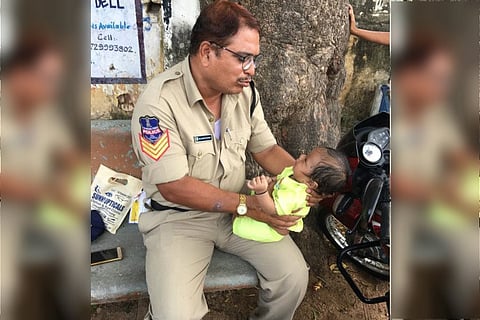 Telangana cop consoles baby as mother writes exam, picture goes viral 