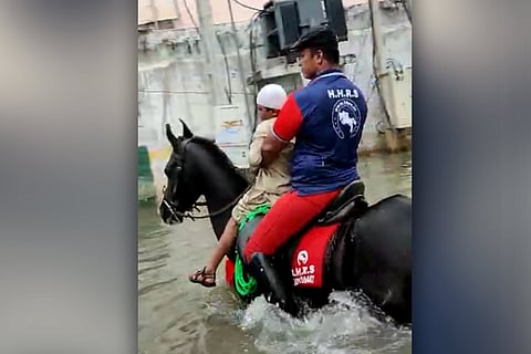 Horsemen rescue stranded people