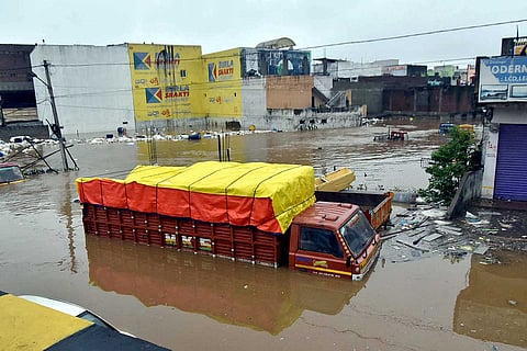 Vehicles submerged in water due to heavy rains in Hyderabad