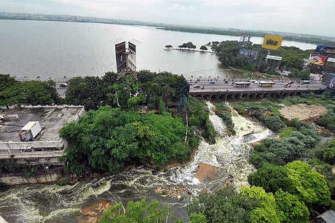 The Hussain Sagar Lake overflowing following incessant rains in Hyderabad