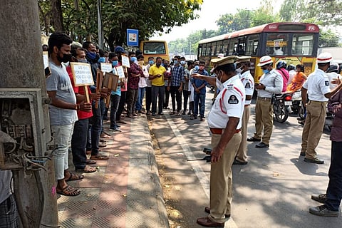 Hyderabad traffic police conducting a mask awareness to a gathering on road