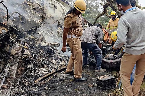Rescue officials at the spot where an IAF Mi-17V5 helicopter crashed in Coonoor