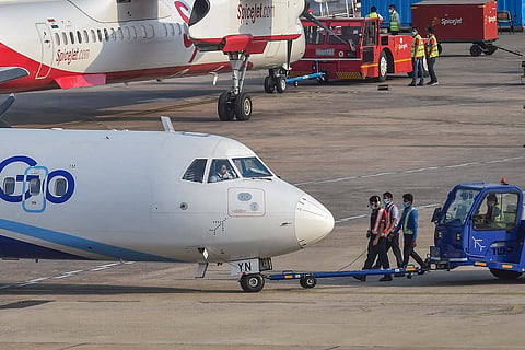 An IndiGo plane on a runway in India