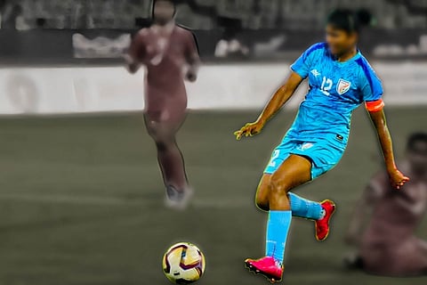 A representative image of a woman playing football