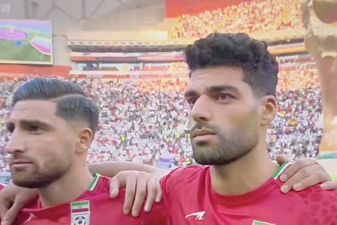 Iran's football team refuses to sing national anthem ahead of their World Cup match against England
