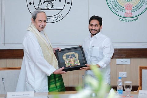 Odisha CM Naveen Patnaik on the left and Andhra CM YS Jagan Reddy on the right, both holding a picture of an idol