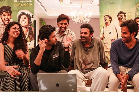 Actors Faria Abdullah, Naveen Polishetty, Priyadarshi and director Anudeep KV with Prabhas 