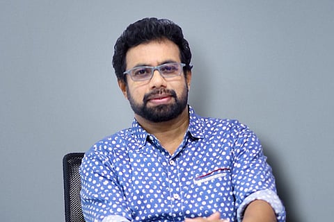 Kerala Rajya Sabha MP John Brittos wearing a light blue shirt