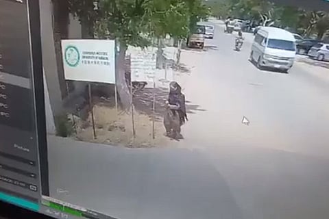 The woman suicide bomber seen outside the University of Karachi moments before the attack