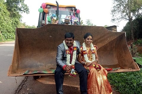 No cars, no horses: K’taka man takes wife home in a JCB machine after wedding