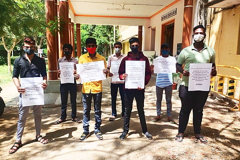 Students protesting by holding posters