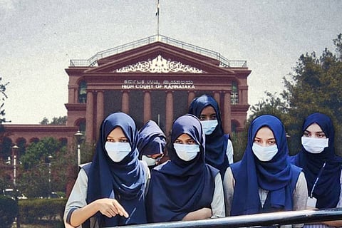 Muslim students wearing hijab in front of a picture of the Karnataka High Court 