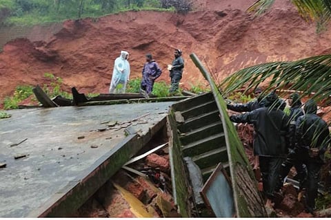 Officials inspecting the spot where the landslide occurred