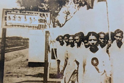 Karunanidhi before the Dalmiapuram railway station sign 