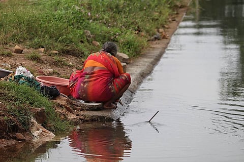 Woman by riverside