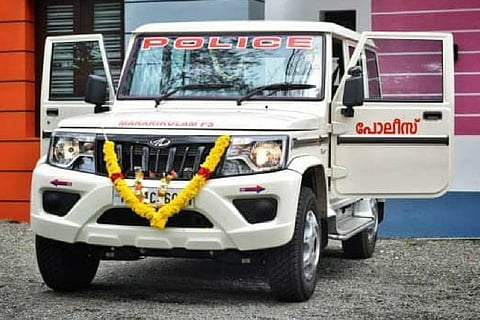 A white colored \Kerala police vehicle