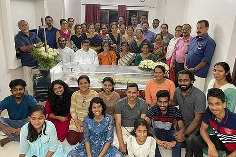 Viral photo of Kerala family who posed smiling beside a coffin 