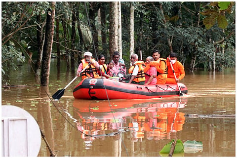 Flood victims rescued on boat in Kerala