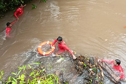 Disaster management personnel work to rescue the marooned people