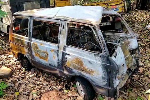 The car that was gutted in the attack by the mob