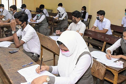 Students attending exams in a school