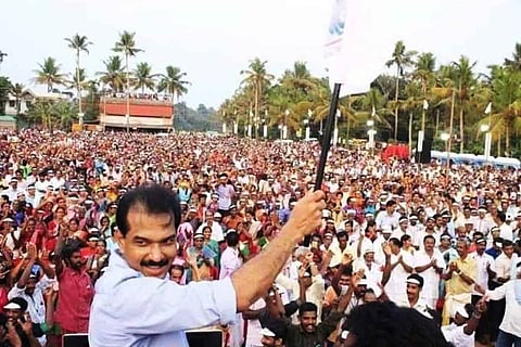 Man standing in front of a large crowd
