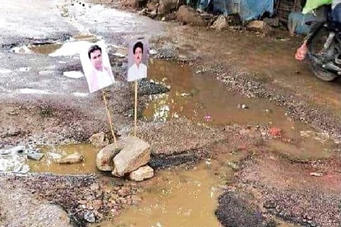 Cong worker decorates Hyd pothole with KTR pics, GHMC fixes it silently at night