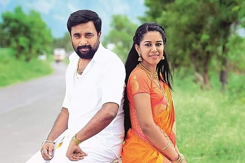Sasikumar is seen wearing a veshti while Mirnalini is seen in a saree in the image from 'MGR Magan'.