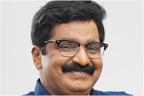 Kerala IUML MLA MK Muneer smiling for a picture 