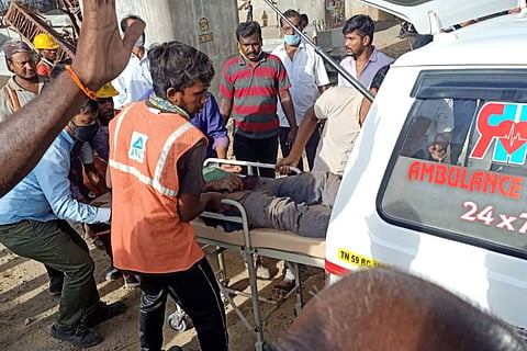 One of the injured construction workers being carried into the ambulance 