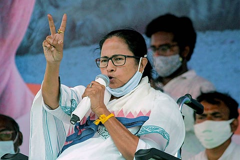 Mamata Banerjee flashes victory sign