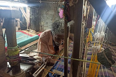 A weaver working on a hand loom in Mangalagiri 