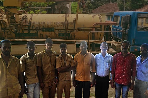 Manual scavengers in Mangaluru with suction machine in background
