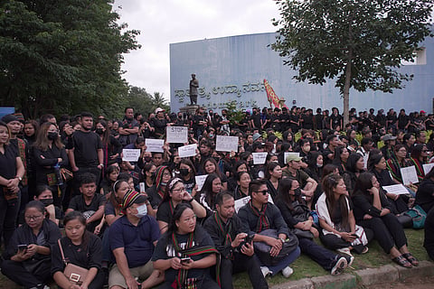 people sitting in protest in freedom park