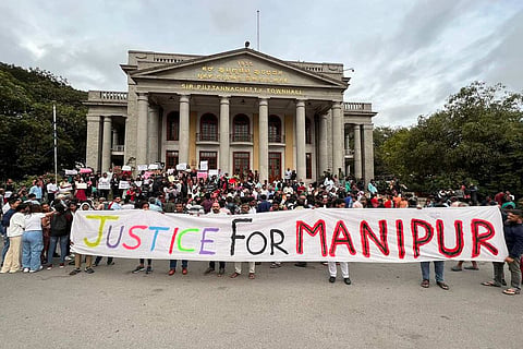 Protestors with poster