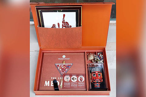 A box with the invitation to Medaram Jatharam, a tribal festival in Telangana