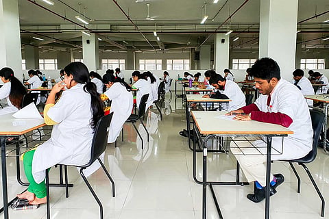 Medical college students writing an exam