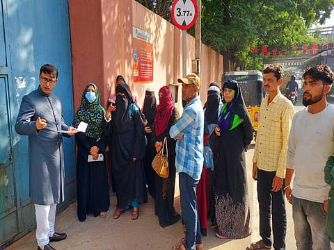 Relatives of the eight minor girls gather outside Children's home for girls, Nimboliadda. 