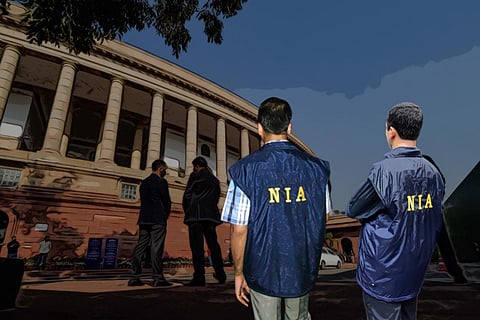 Representative image of NIA officials with the Indian Parliament in the background