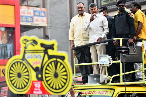  TDP chief Chandrababu Naidu and party state president Kinjarapu Atchannaidu campaigning for Vijayawada municipal elections standing on top of a campaign vehicle