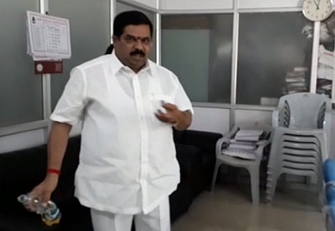 Watch: Bengaluru Cong leader splashes petrol inside govt office, threatens fire