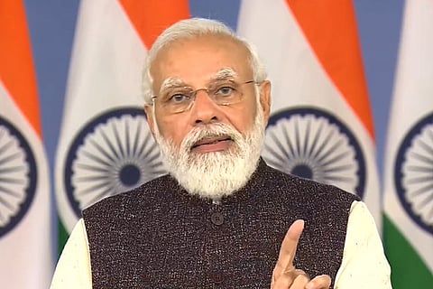 India Prime Minister Narendra Modi seen wearing black coat and speaking to the camera