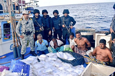 Indian Navy officials along with arrested men