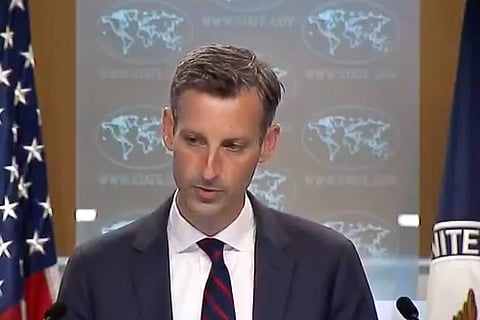 State Department spokesperson Ned Price in a navy blue suit and tie
