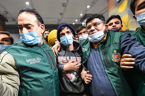 File photo of Neeraj Bishnoi being escorted by the Delhi police