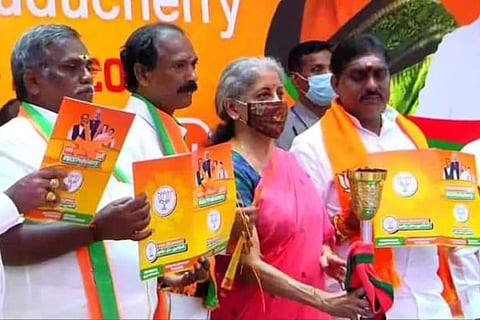 Union Finance Minister Nirmala Sitharaman along with BJP functionaries releasing the manifesto at Puducherry 