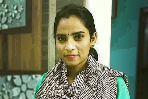 Dalit labour activist Nodeep Kaur wearing a grey scarf over a green kurta