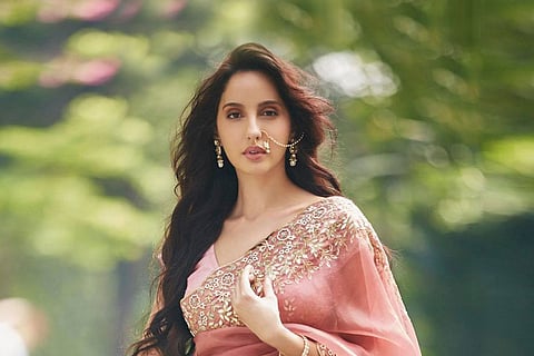 Bollywood actor Nora Fatehi wearing a saree