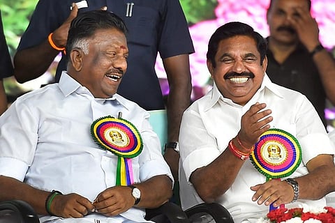 O Paneerselvam and Edappadi K Palaniswami seen seated together and laughing