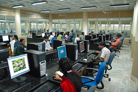 Representative image of employees sitting in an office